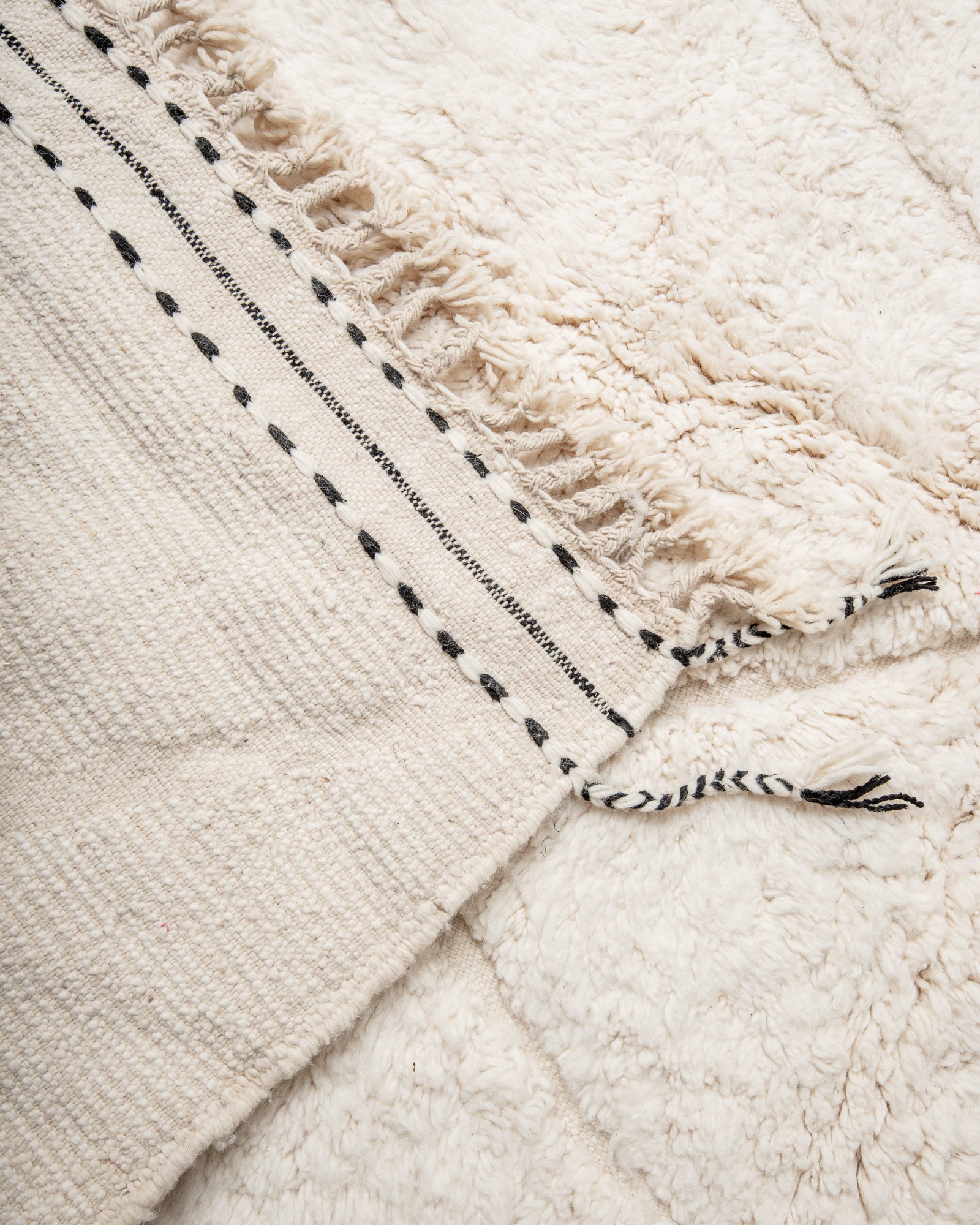 Modern, designer, handcrafted Berber rug from Morocco. Beniourain carpet with minimalist design, natural wool pile and a fluffy texture.